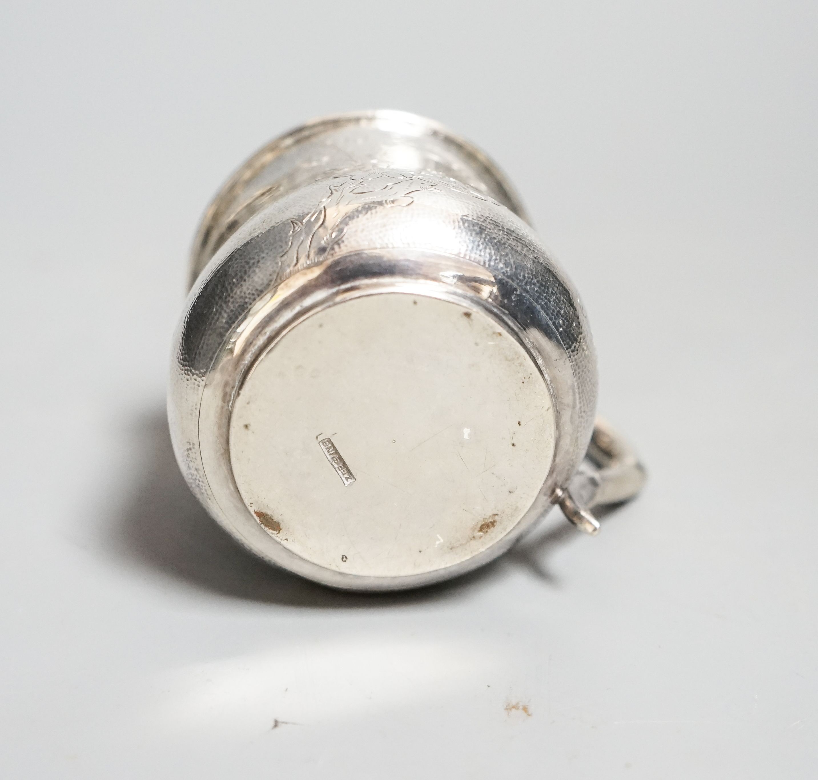 A Chinese white metal christening mug, by Zee Sung, 55mm.